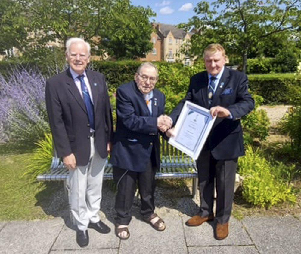 Edd receiving his Certificate & Badge